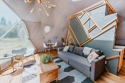 Cedar Dome interior with sofa and skylights at Akasha Farm